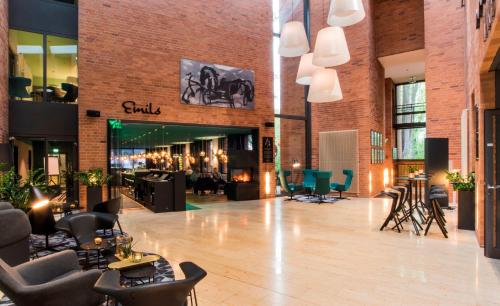 a lobby of a store with chairs and tables at Arcadeon in Hagen