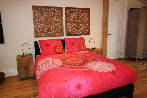 מיטה או מיטות בחדר ב-B&B Het Koetshuis