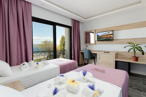 Postel nebo postele na pokoji v ubytování Sunsan Hotel