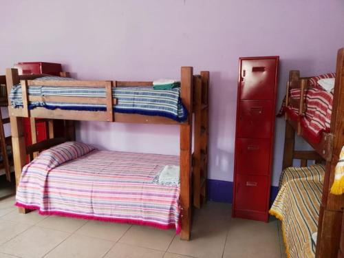 Ein Bett oder Betten in einem Zimmer der Unterkunft Olga Querida B&B Hostal