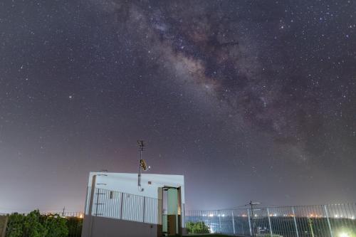 a building with the milky way in the sky at Comfort House In Miyakojima in Miyako-jima