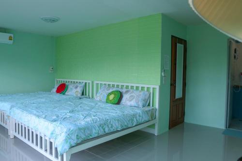 Ein Bett oder Betten in einem Zimmer der Unterkunft Ingkho Khao Kho อิงค้อ เขาค้อ