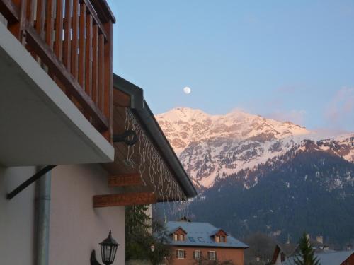 a building with a view of a mountain at Hôtel Le Beauséjour in Saint-François-Longchamp
