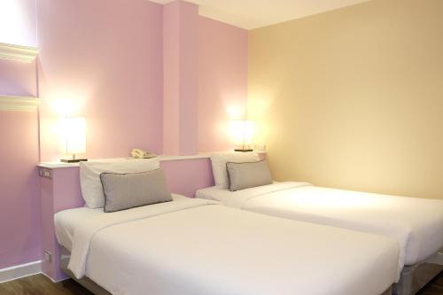 Кровать или кровати в номере The Beach Boutique House