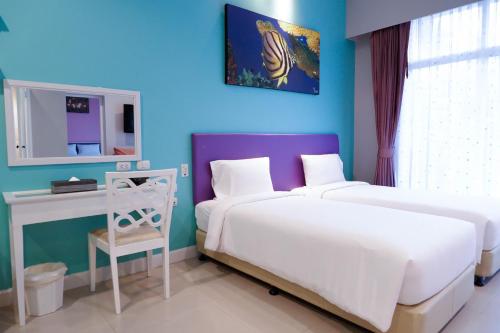 Кровать или кровати в номере The Beach Boutique House