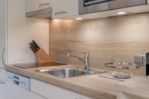a kitchen with a sink and a counter top at Appartement Cristallo in Sölden