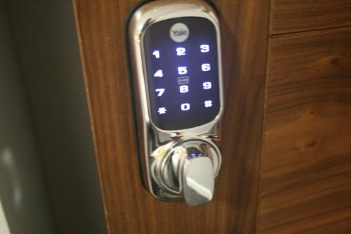 a close up of a remote control on a door at The Spring Bank APARTHOTEL in Preston