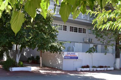 a building with a clinic sign in front of it at Galanis Studios and Apartments in Platamonas