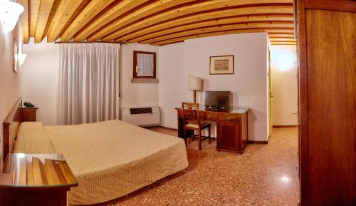 Postel nebo postele na pokoji v ubytování Hotel Riviera dei Dogi