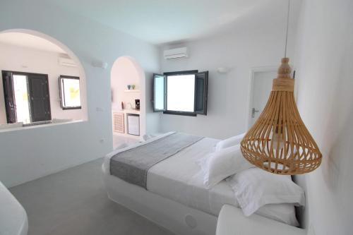 Postel nebo postele na pokoji v ubytování Filira Suites