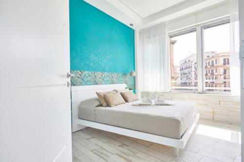Una cama o camas en una habitación de Luxury Experience | WelcHome Napoli