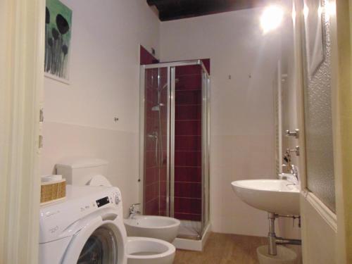 a bathroom with a sink and a toilet and a shower at Bargello Guest House in Florence