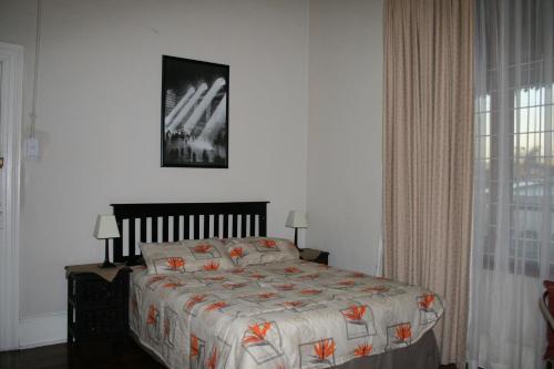 En eller flere senge i et værelse på Glen Lilly Self Catering