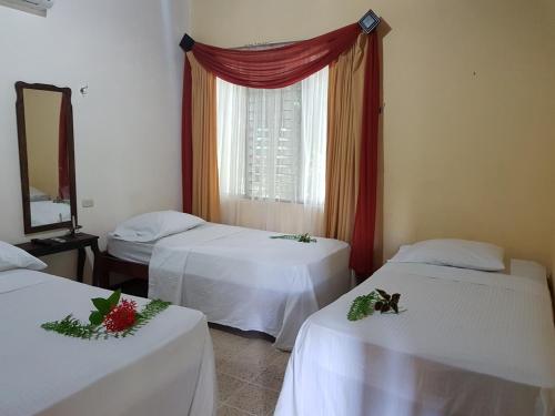 Cama ou camas em um quarto em Cristina - Hotel Familiar