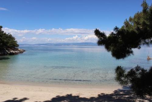 a view of a beach with a boat in the water at Sunsets in Thassos 2 in Skala Sotiros