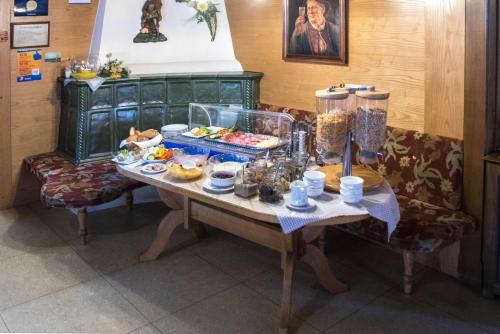 a table with a buffet of food on it at Gasthof Pension Traube in Karres