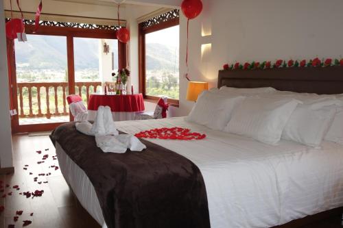 Ένα ή περισσότερα κρεβάτια σε δωμάτιο στο Hotel Puente Piedra