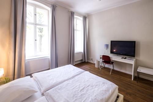 TV a/nebo společenská místnost v ubytování Jasper's Boutique Hotel
