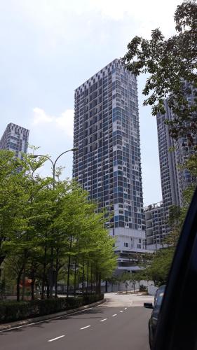 a city street with trees and tall buildings at Tini Icity Guesthouse in Shah Alam