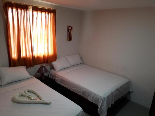 Hostal El Naufrago 1にあるベッド