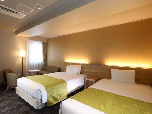 Кровать или кровати в номере Hotel Hokke Club Kyoto