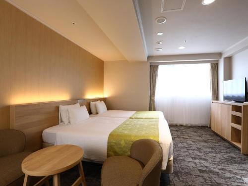 Кровать или кровати в номере Hotel Hokke Club Kyoto
