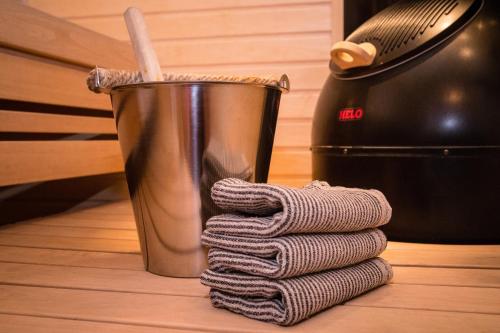 a stack of towels next to a trash can at Åre Travel - Tottbacken in Åre