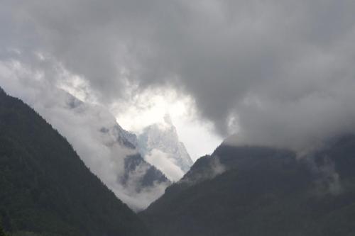 a mountain obscured by clouds in the mountains at Xeishittn SternenNest in Hieflau