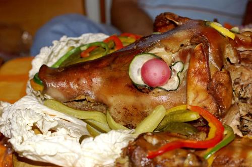a close up of a chicken sandwich with vegetables at Chata Ilčík in Terchová