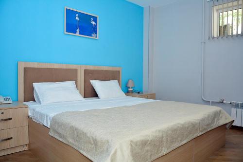 Ένα ή περισσότερα κρεβάτια σε δωμάτιο στο Flamingo Hotel Baku