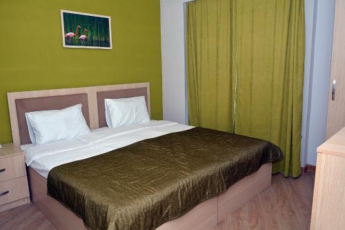 Ένα ή περισσότερα κρεβάτια σε δωμάτιο στο Flamingo Hotel Baku