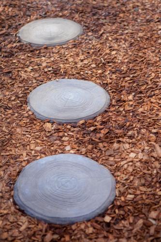 three frisbees are sitting on the ground at FortyTwo - Oceanside Retreat Busselton in Busselton