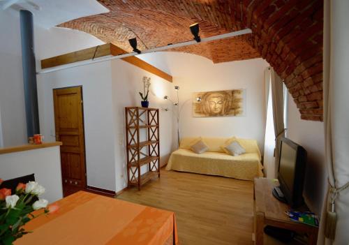 a living room with a couch and a television at Haus Ferdinand in Fernitz