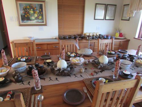 
a kitchen filled with pots and pans and dishes at Melkhoutkloof Guest House in Outeniqua Strand
