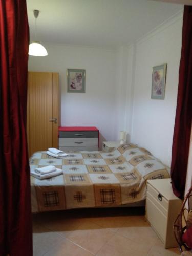 a bedroom with a large bed in a room at St James Apartment in Luz
