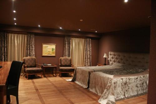 Ένα ή περισσότερα κρεβάτια σε δωμάτιο στο Ventura Boutique Hotel