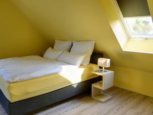 Una cama o camas en una habitación de Fewo Obsthof Matthies