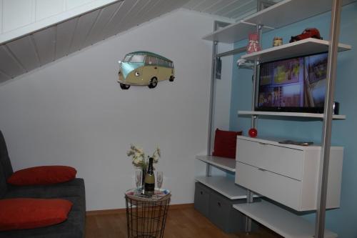 a living room with a couch and a tv at Ferienhaus LIVI in Zandt