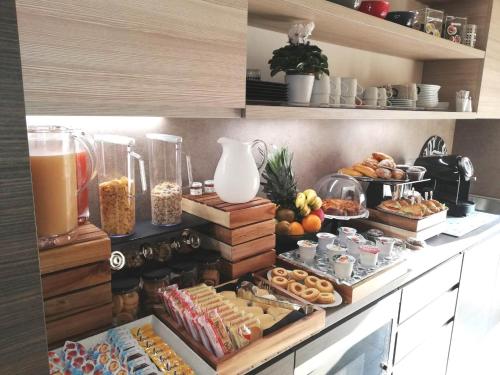 a kitchen with a bunch of food on a counter at B&B Fablas in Verona