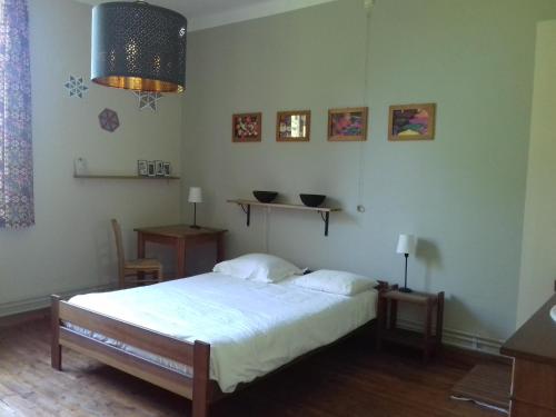 a bedroom with a bed in a room at Thirifays, résidence de vacances in Chiny