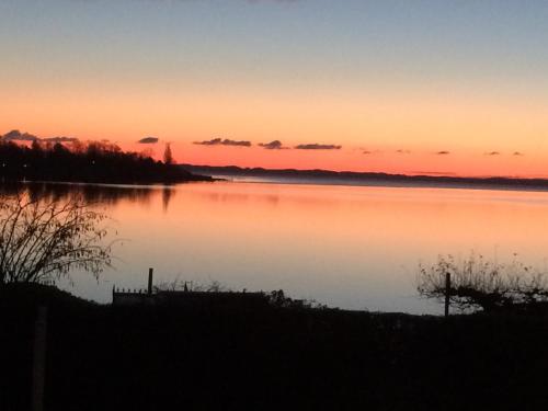 a view of a lake at sunset at Troense Bed and Breakfast by the sea in Svendborg