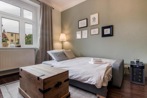a small bedroom with a bed and a window at APT with sunny garden Prague by Michal&Friends in Prague