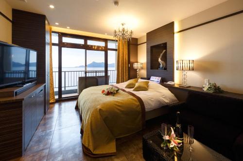 Postel nebo postele na pokoji v ubytování HOTEL MYTH-Resort -ホテル マイス リゾート- adult only