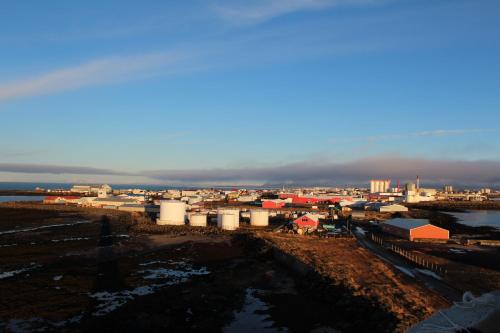 a view of a city with buildings and water at Teigur Guesthouse in Akranes