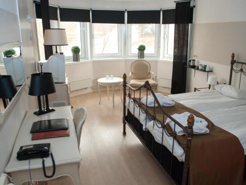 Un ou plusieurs lits dans un hébergement de l'établissement First Hotel Olofström