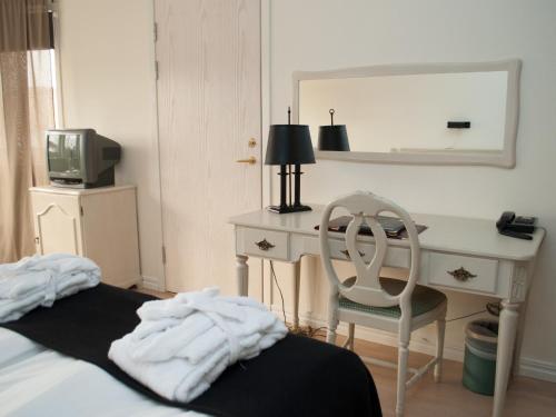 Un ou plusieurs lits dans un hébergement de l'établissement First Hotel Olofström