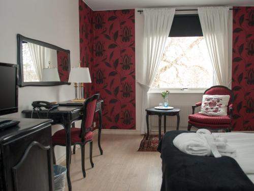 Un ou plusieurs lits dans un hébergement de l'établissement First Hotel Olofström