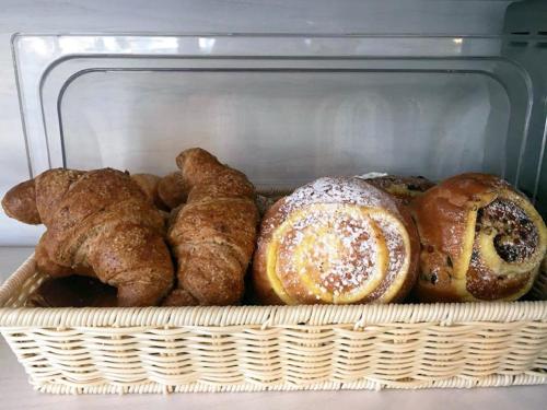 a basket filled with different types of pastries at B&B Sorrento Central in Sorrento