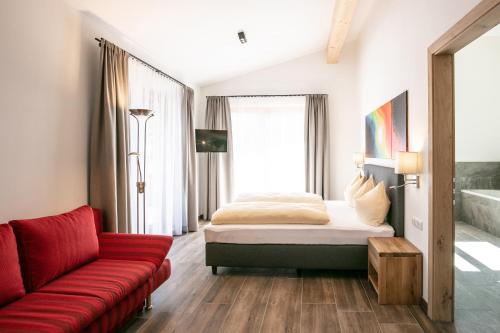 A bed or beds in a room at Amadeus Appartement