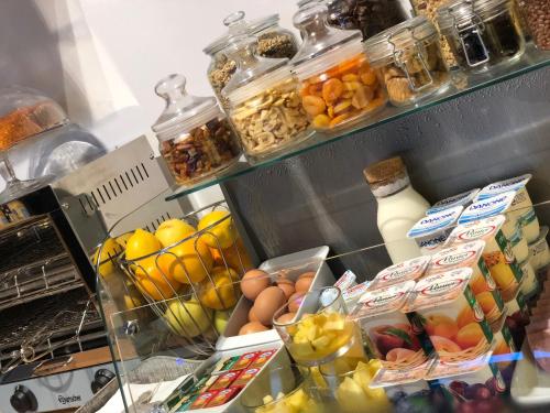 a refrigerator filled with lots of different types of food at FastHôtel Biarritz Bidart Côte-Basque - Un hôtel FH Collection in Bidart